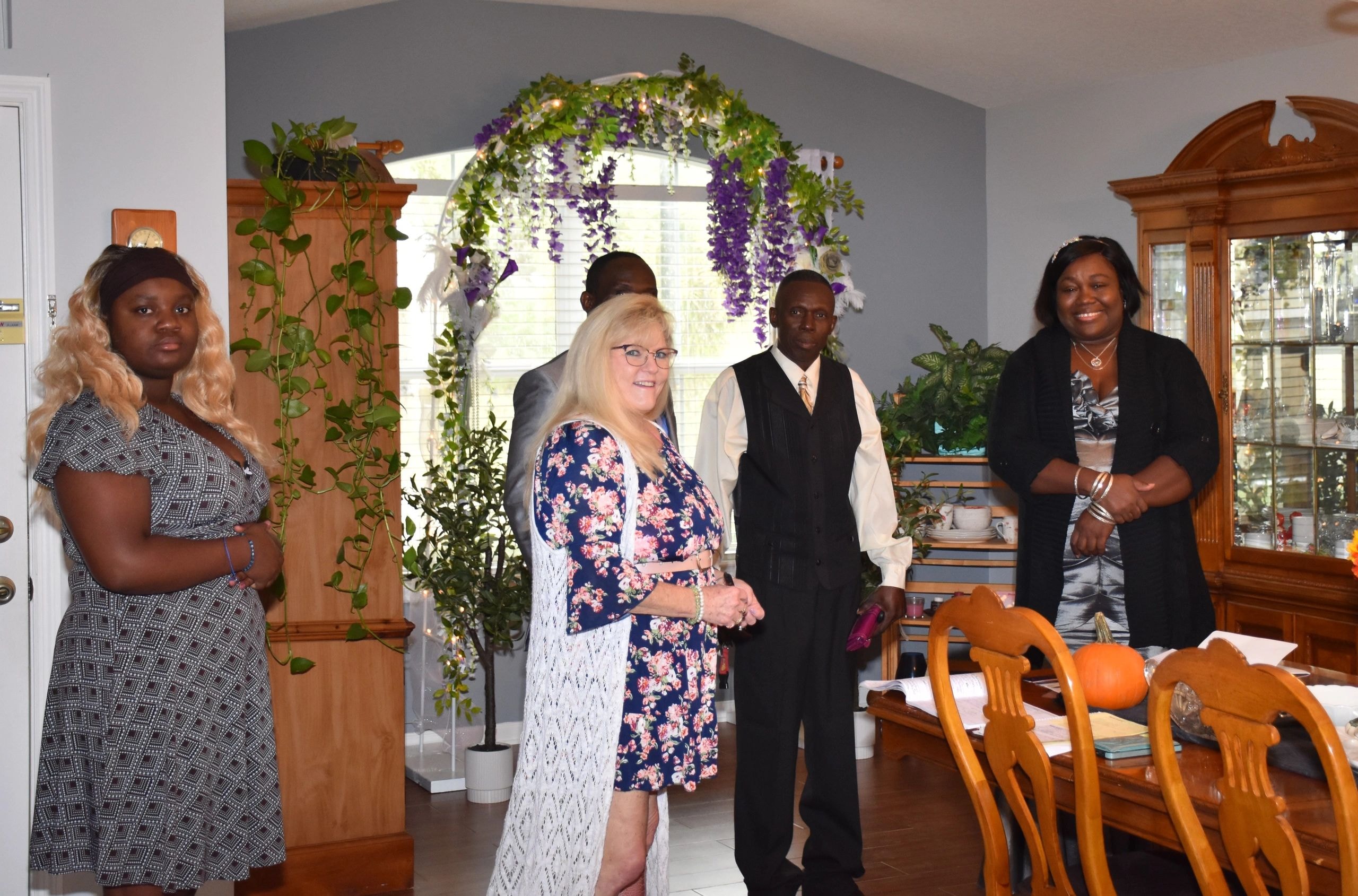 Wedding ceremony group with floral arch